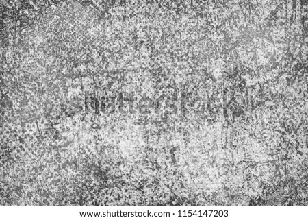 The texture is black and white in grunge style. Abstract monochrome background. Pattern of chips, cracks, scuffs, dust, stains