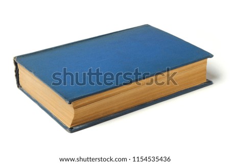 Thick old book in a hard blue cover isolated on white