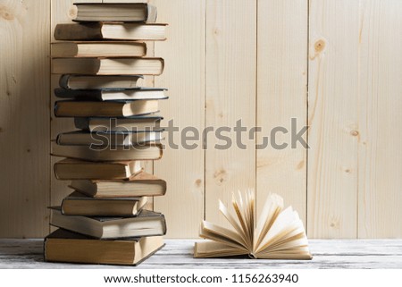 Open book, hardback books on wooden table. Back to school. Copy space