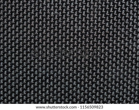 Black car textile macro texture. Detail of Gray Car Upholstery. Parts of textile car seats inside modern european car.
