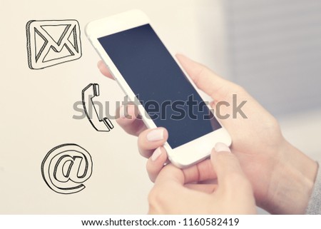 Woman uses a smartphone.Concept of calling, sending e-mail, messages and SMS.