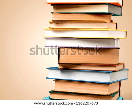 Colorful books collection on classroom background