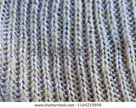 Wool hand knit fabric stocking ribbed stitch side, close up