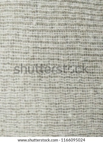 The background image is a gray fabric stripes.
