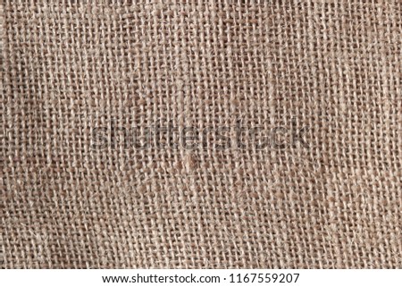 Brown sackcloth texture background. Closeup of light natural burlap pattern.