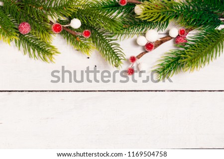 Christmas fir branches with different decoration - citrus slices, sparkling balls and pine cones. Winter holidays.
