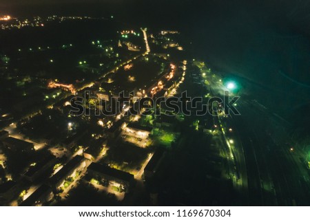 Junction Railway Station with lots of Lines and Freight Trains at Night. Aerial View. Location Kandalaksha Russia