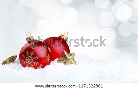 Christmas balls in snowflakes on background