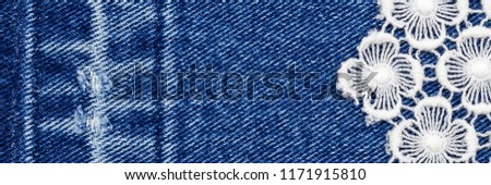 Openwork fabric lace on denim jeans background, banner fashion background