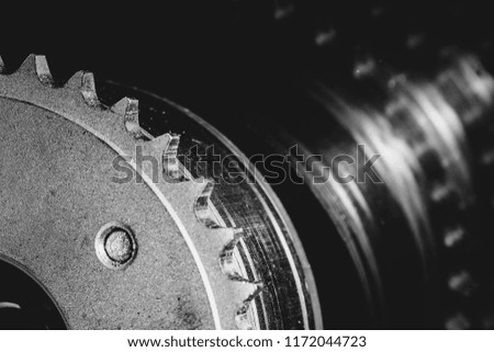 Monochrome background image of gear close up. Artwork from auto part in macro photography in grayscale.