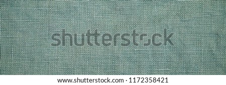 Linen fabric texture, copy space banner. Stone washed pure linen green background