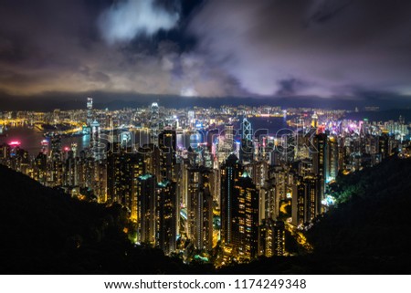 Hong Kong cityscape and Victoria Harbor at night in Hong Kong, China. 