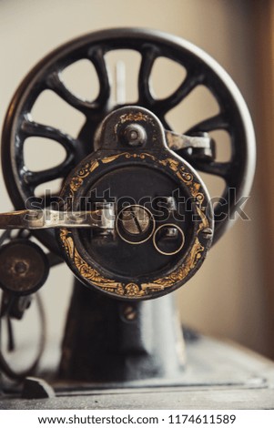 Wedding rings on vintage sewing machine
