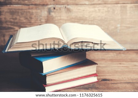 books on wooden table background