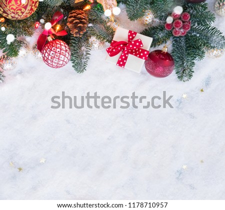 Christmas evergreen tree decorated with golden and red balls in white snow, christmas flat lay scene