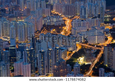 a big asia city by night to the sunrise with all the lights on the streets and skyline