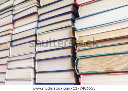 Stack of Used Old Books Background, Books of Different Thickness and Color, Many Books Piles in the School Library, Pile of Old Books Stacked on Top of Each Other, Education Background, Back to School