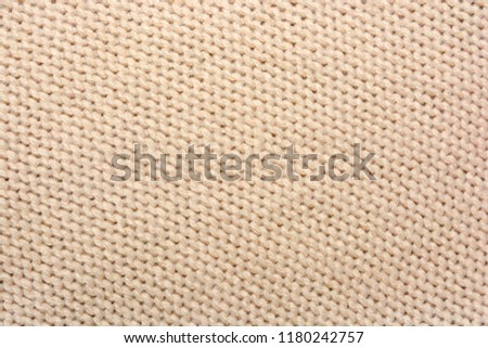 Texture knitted beige fabrics for the background  