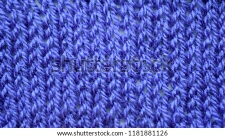 A hand knitted textile