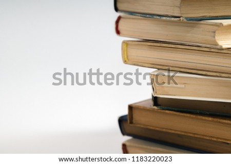 Open book, hardback hard cover colorful books stacked on the table. Back to school. Copy space for text. Education, studying, learning, business concept