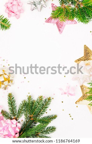 Pastel Pink confetti, bows and paper decorations. Flat lay, top view. Holiday composition for  New year or Christmas celebration. Flat lay, top view