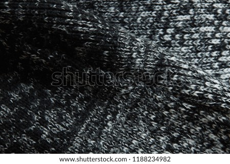 warm gray light dark gradient woolen sweater fabric texture background wool close-up. season winter autumn spring