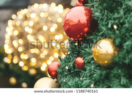 Close-up of Christmas decorations. Red and gold balls on a Christmas tree.