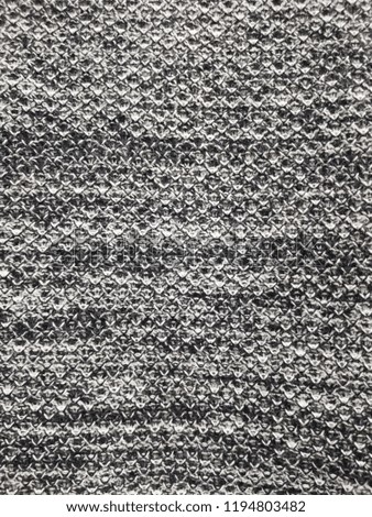 Knitted background. Knitted gray texture. Knitting pattern of wool. Knitting. Background.