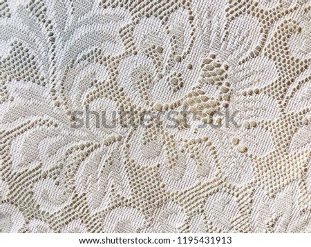 White lace isolated on brown background