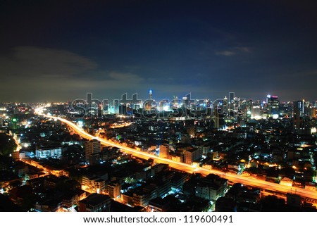 cars light in modern city at twilight