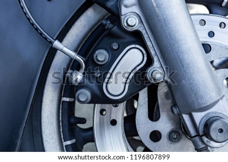 Close up of Vintage motorcycle parking on the road. Croped view, wheel