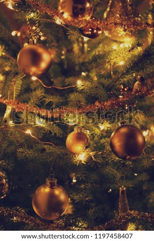 Toy and Christmas tree background.Christmas dark festive glowing background