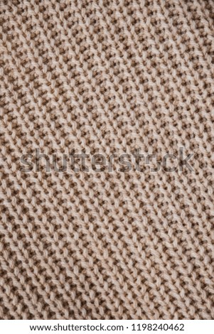 brown texture of a woven piece of cloth made of a sweater
