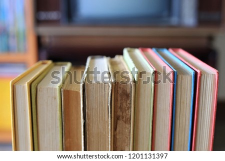 Close-up of old books placed in rows in library selective focus and shallow depth of field