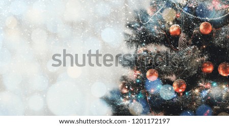 Decorated Christmas tree on fairy background with copy space for text