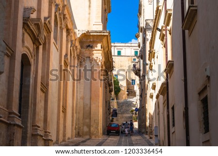 Narrow traditional street in Noto, Sicily, Italy.