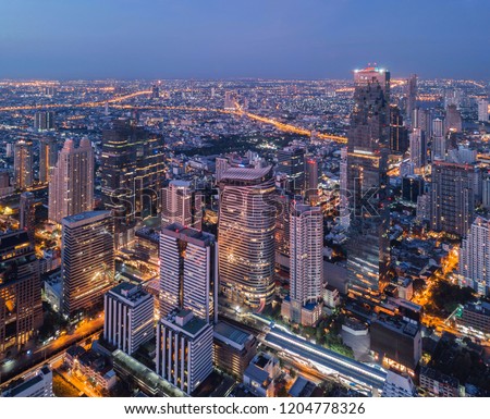 Aerial view of Chong Nonsi, Sathorn, Bangkok Downtown. Financial district and business centers in smart urban city in Asia. Skyscraper and high-rise buildings at night.