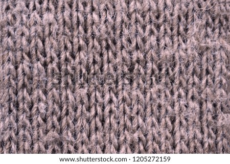 Fluffy taupe knitted texture for the background