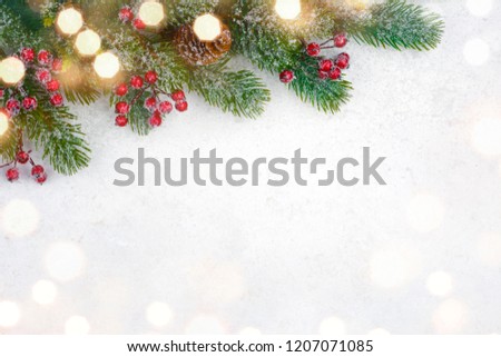 Christmas background design with decorated fir tree branch and snow