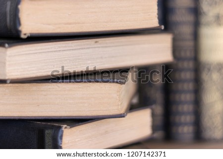 Stack of Old Books with Rough Cut Deckle Edge Pages Selective Focus