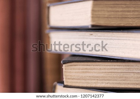 Stack of Old Books with Rough Cut Deckle Edge Pages Selective Focus