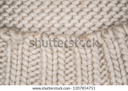 Background white knitted fabric with a pattern