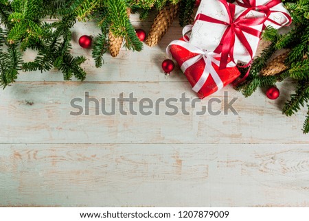 Classic Christmas background, xmas tree ornaments and branches with gift boxes, top view copy space 