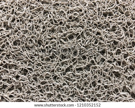 Gray plastic doormat texture and background