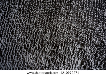 black dark color hairy fur textured carpet mat wallpaper background