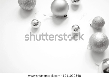 Christmas silver sparkling Ornaments. Christmas background. Holidays festive decorations isolated on white background. Perfect for greeting cards.