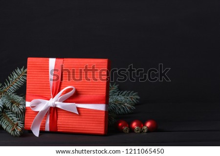Gift box with fir tree and balls glass with space for Christmas greetings