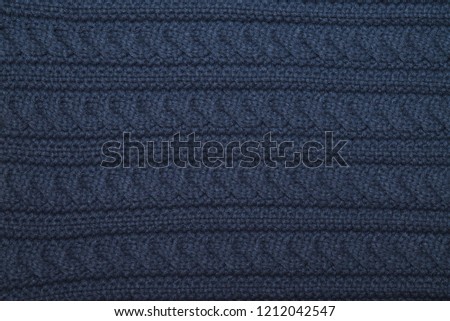 Handmade blue knitting wool texture background.