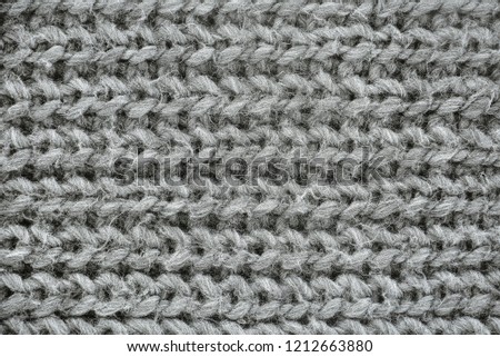 close up soft gray knitted scarf texture for background