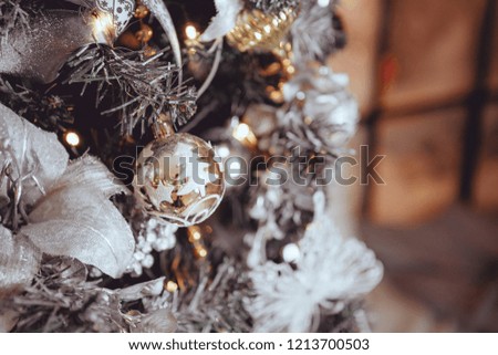 Christmas toys, balls on the tree. christmas and new year, garland, blurred background with lights, decorated christmas tree